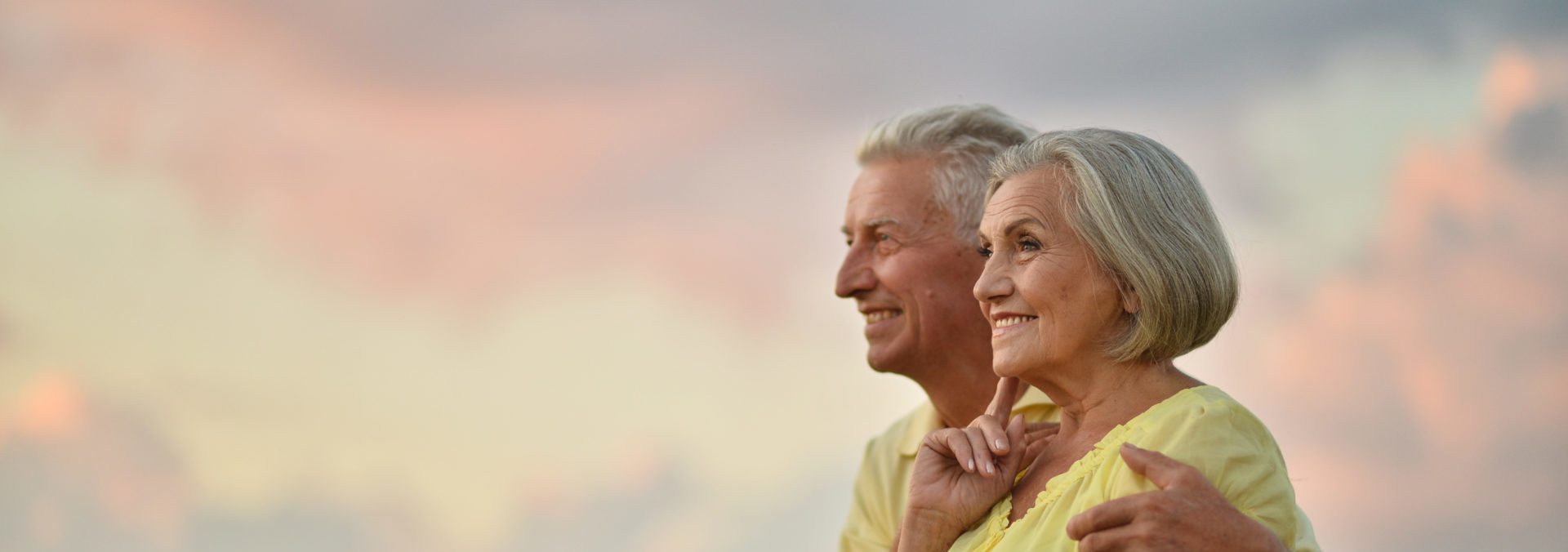 elderly couple on the background of sky